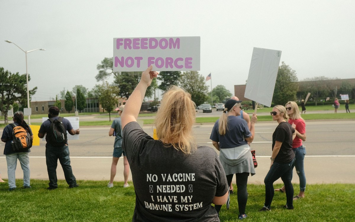 Protestors carrying signs.