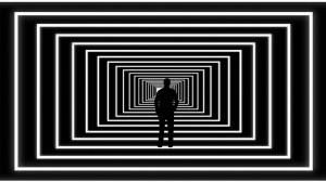 Illustration of person looking at light at end of abstract tunnel.