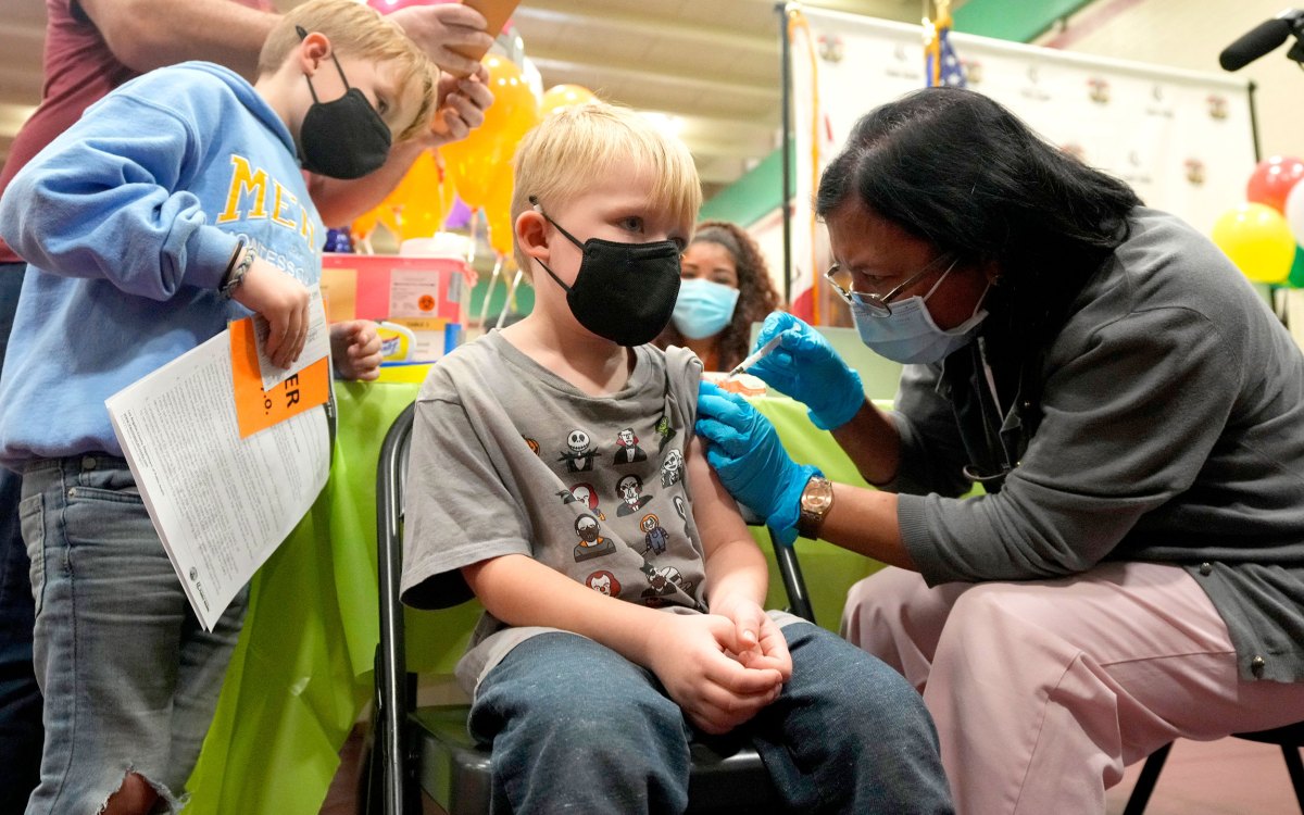 Boys being vaccinated.