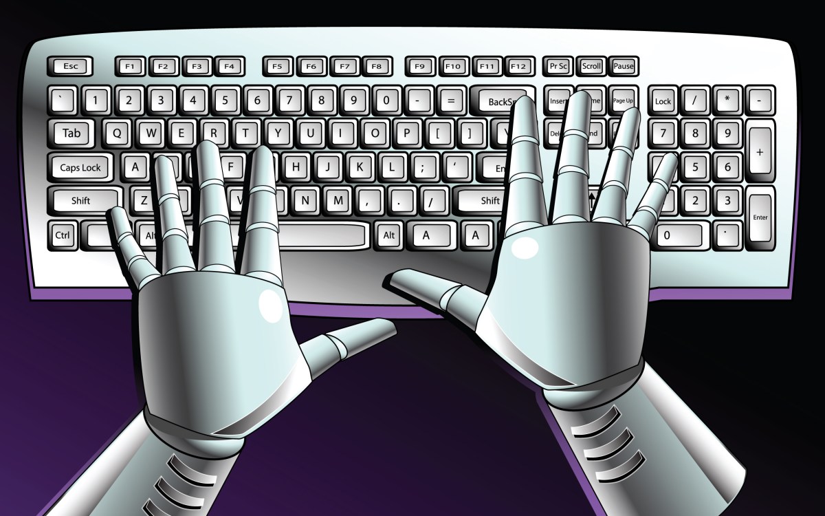 Robot's hands on keyboard.