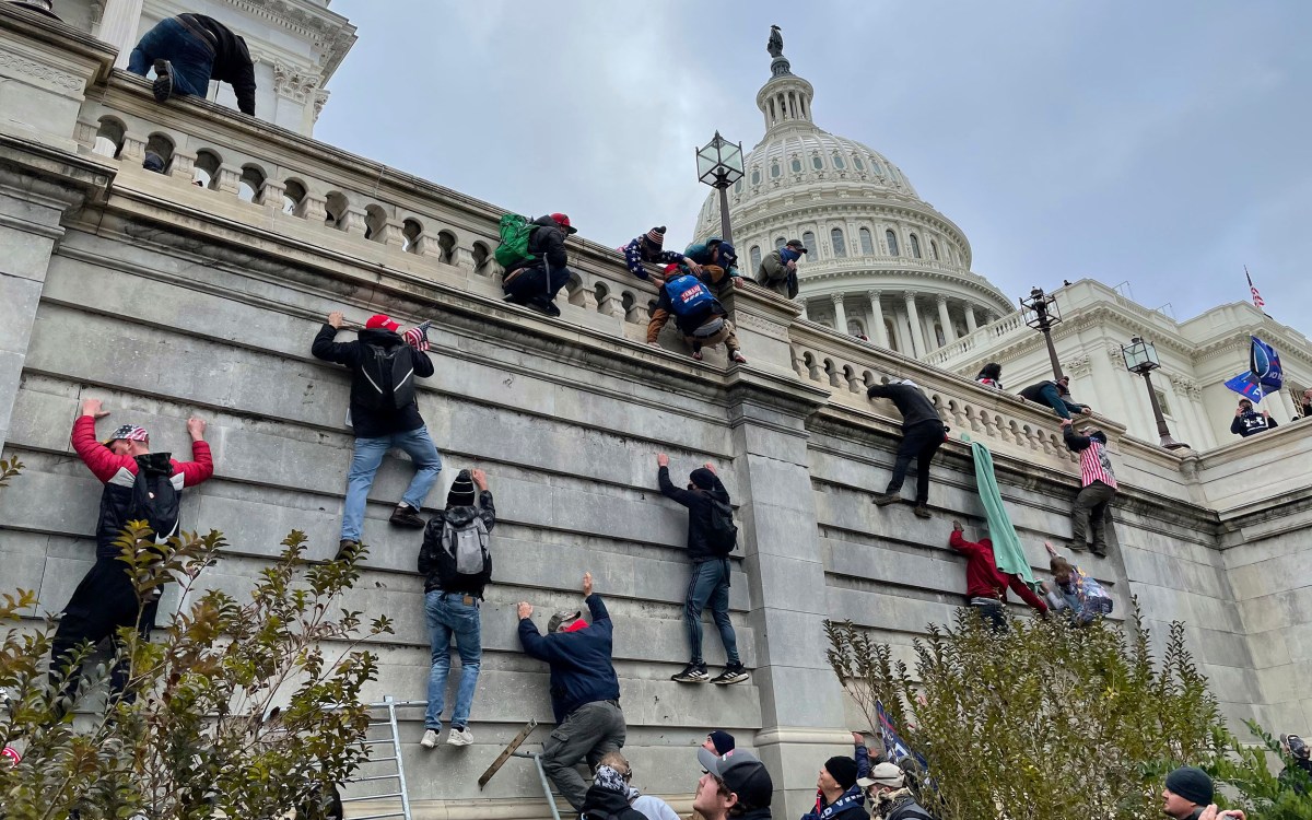 Trump supporters scale west wall of the the U.S. Capitol Jan. 6.