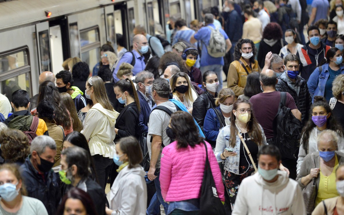 People in a crowd wearing masks.