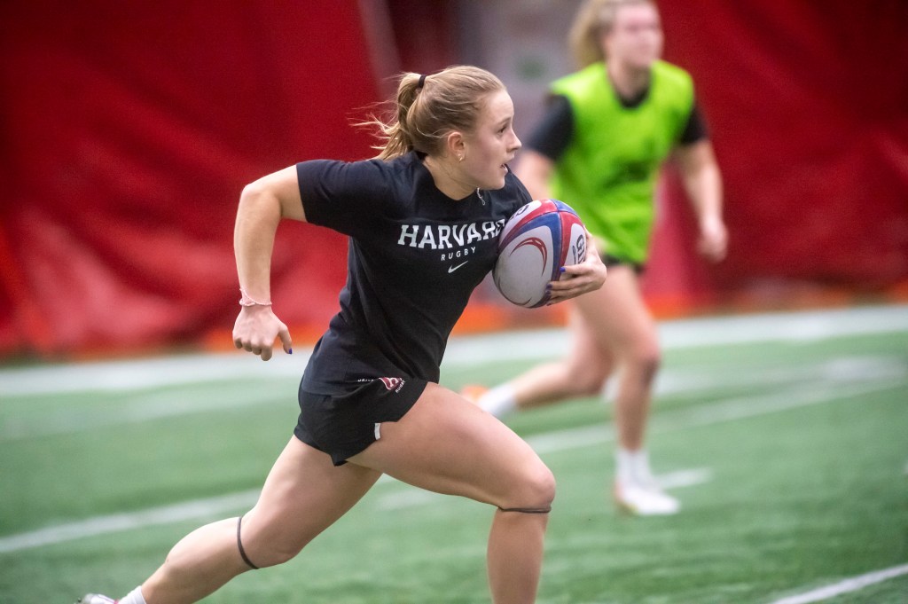 Cass Bargell playing rugby.