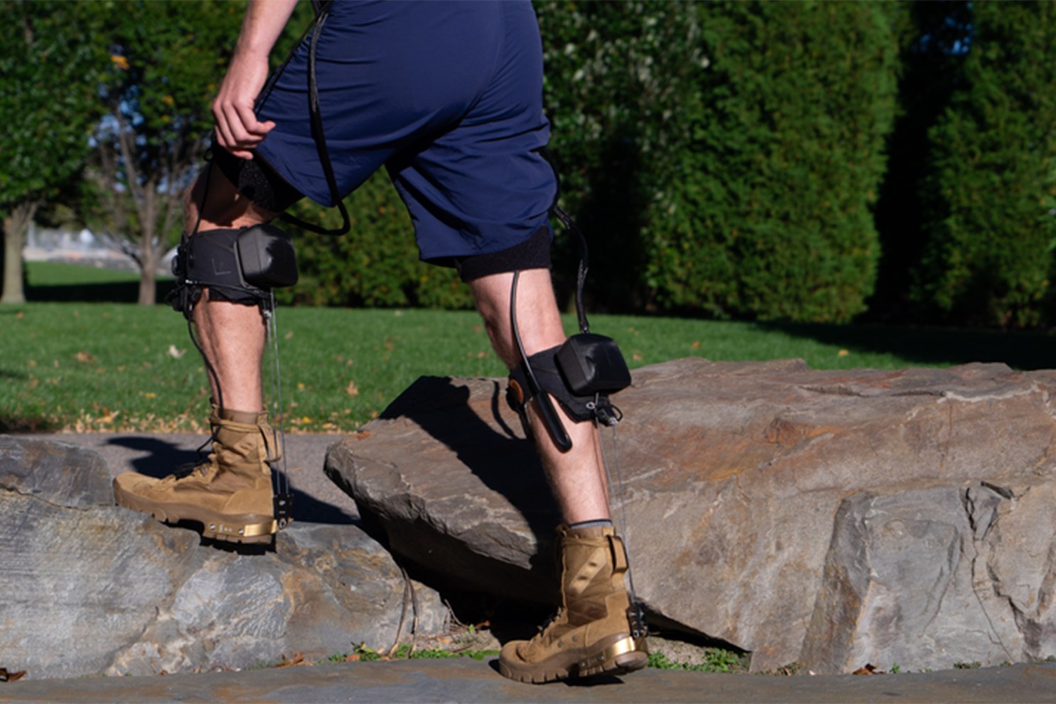 Man with robotic technology attached to leg.