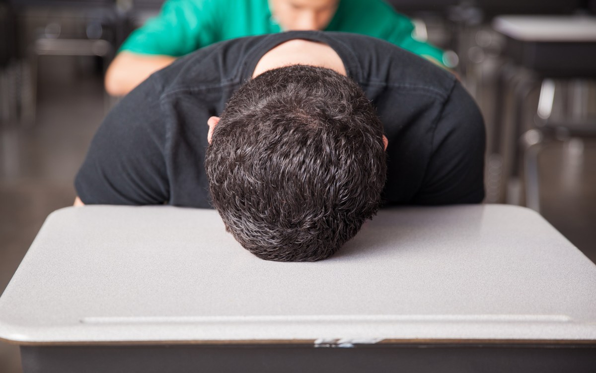 High school student asleep on desk.