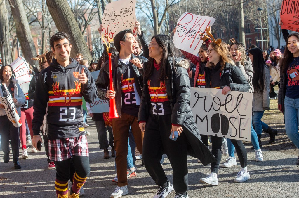 Dunster House members march toward Matthews Hall.