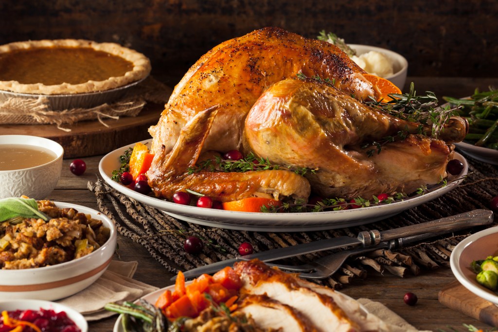 Thanksgiving spread with turkey and sides.