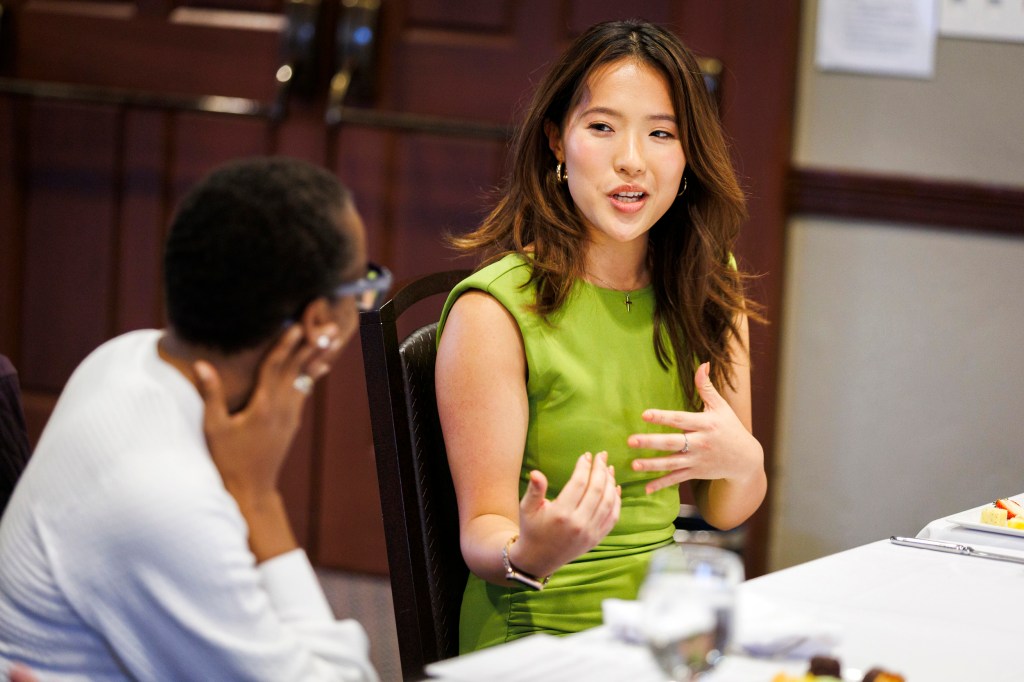 Claudine Gay (left) and Fellow Lucy Tu talk during the event.