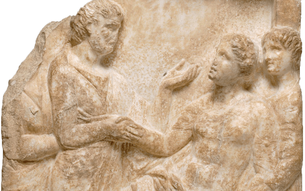 Marble sculpture depicts woman giving birth comforted by people around her.