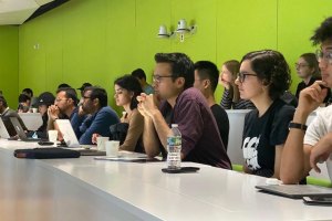 Undergraduate students listening to lecture.