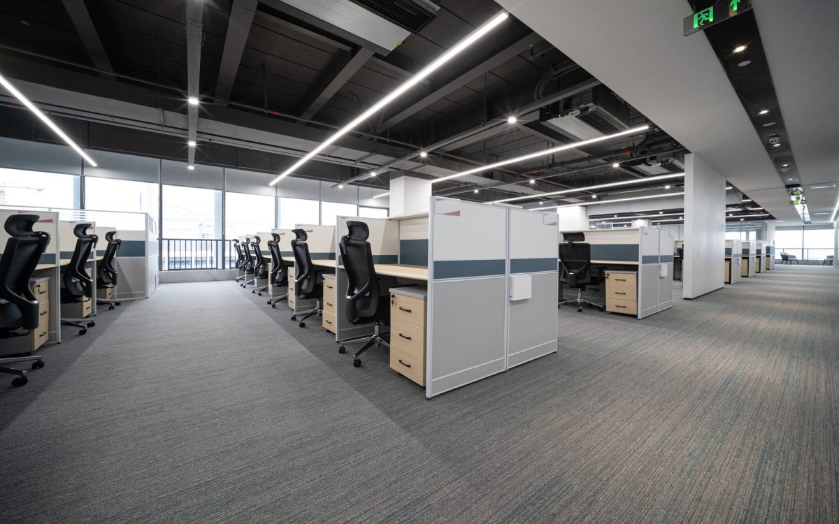 An office full of empty chairs and desks