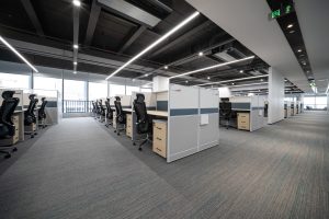 An office full of empty chairs and desks