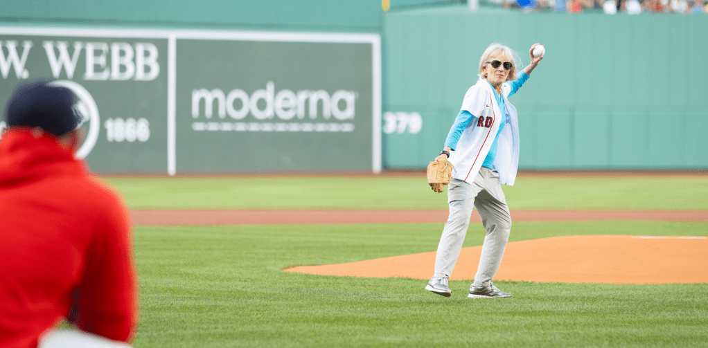 Claudia Goldin throwing the first pitch at Fenway Park. 