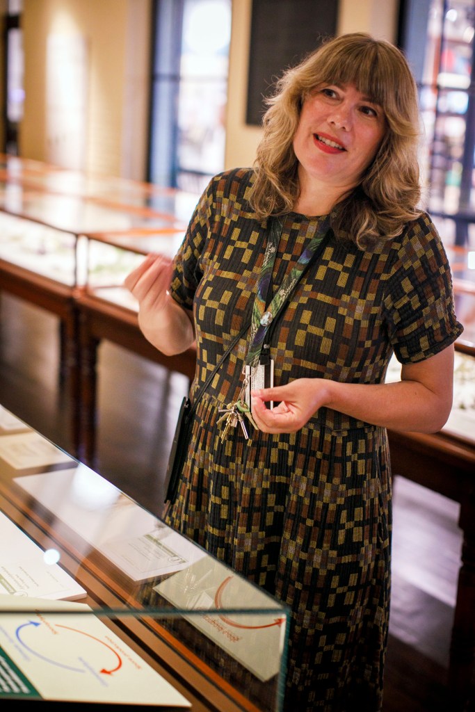 Collection Manager Jennifer Brown is pictured in the Glass Flowers gallery.