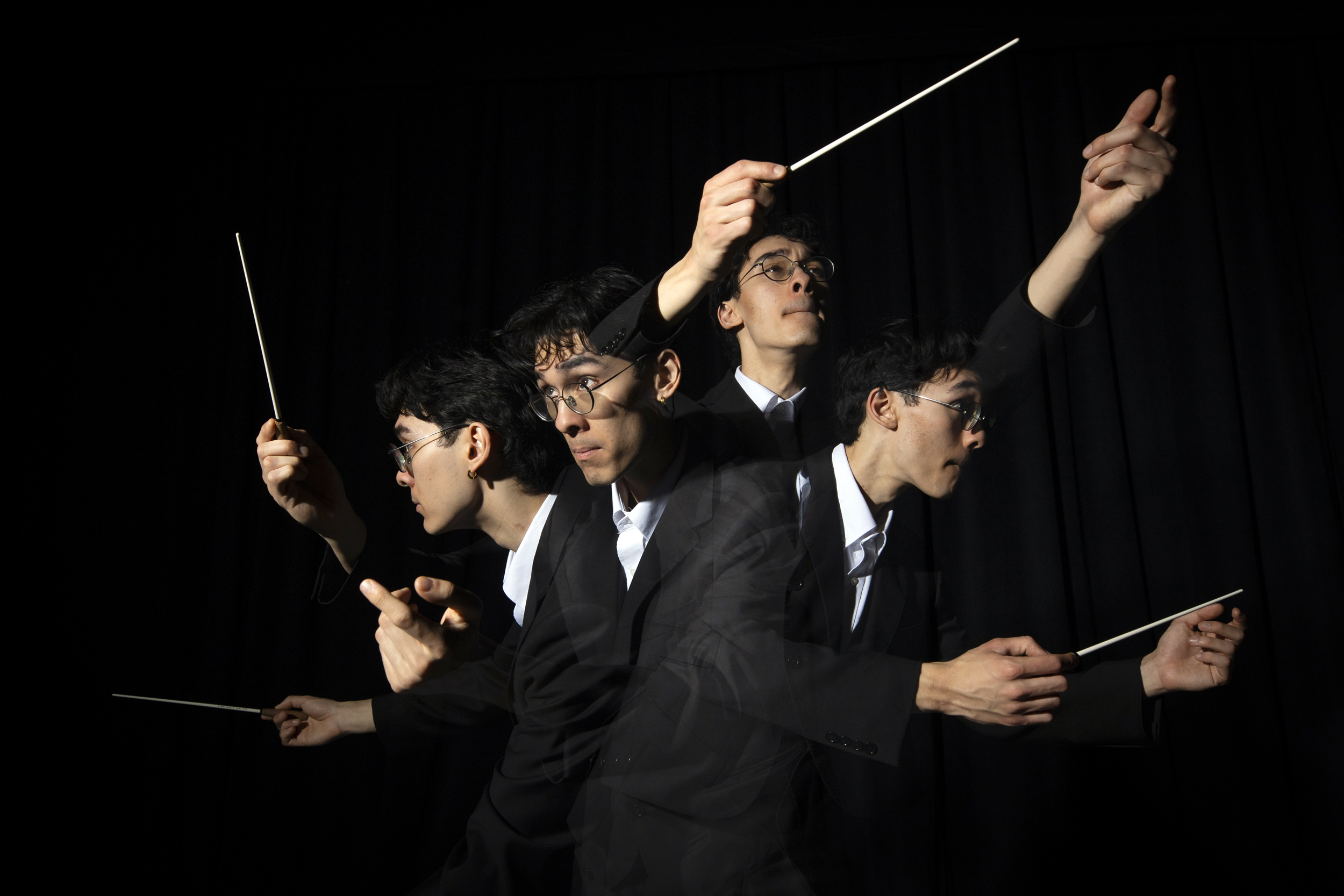 Lucas Amory ’25, Assistant Music Director and Conductor of the Harvard Bach Society, conducts.