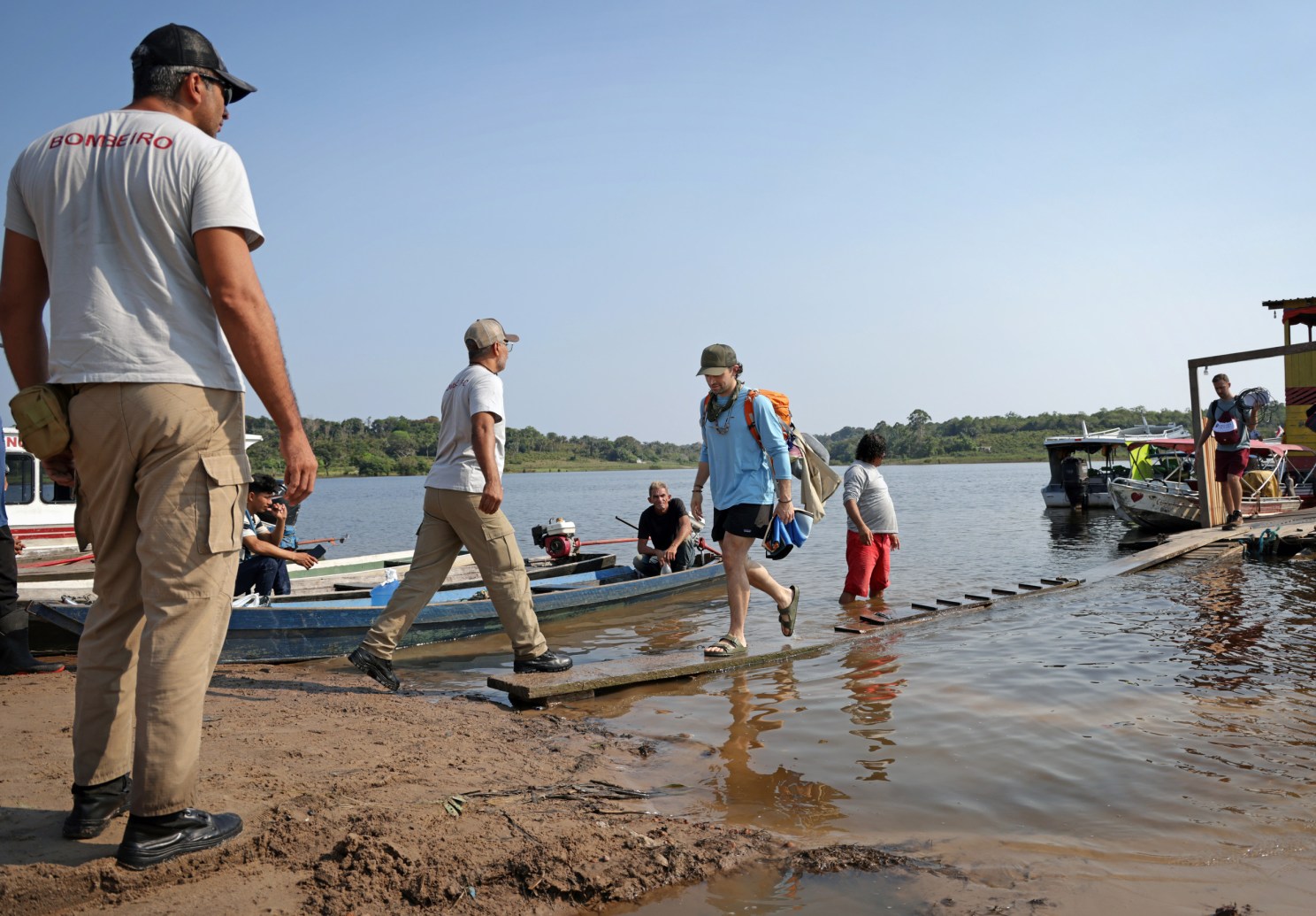 Nicholas Arisco exits a boat along the Uatumã River. 