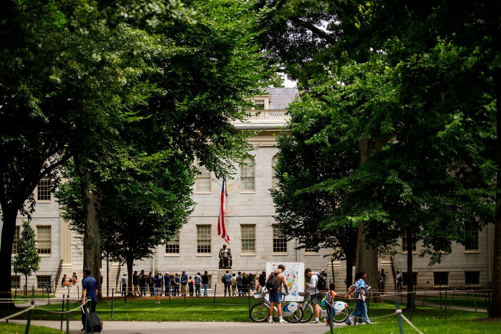 John Harvard Statue in Harvard Yard draws a cloud.