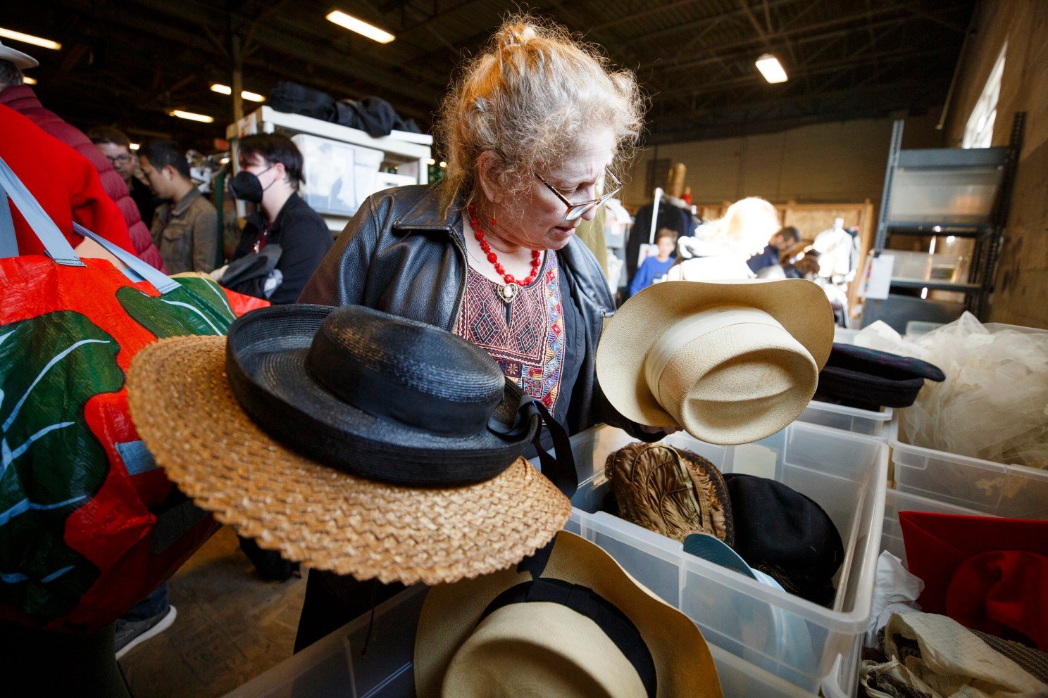 Tzviyah Rosenstock looking at hats 