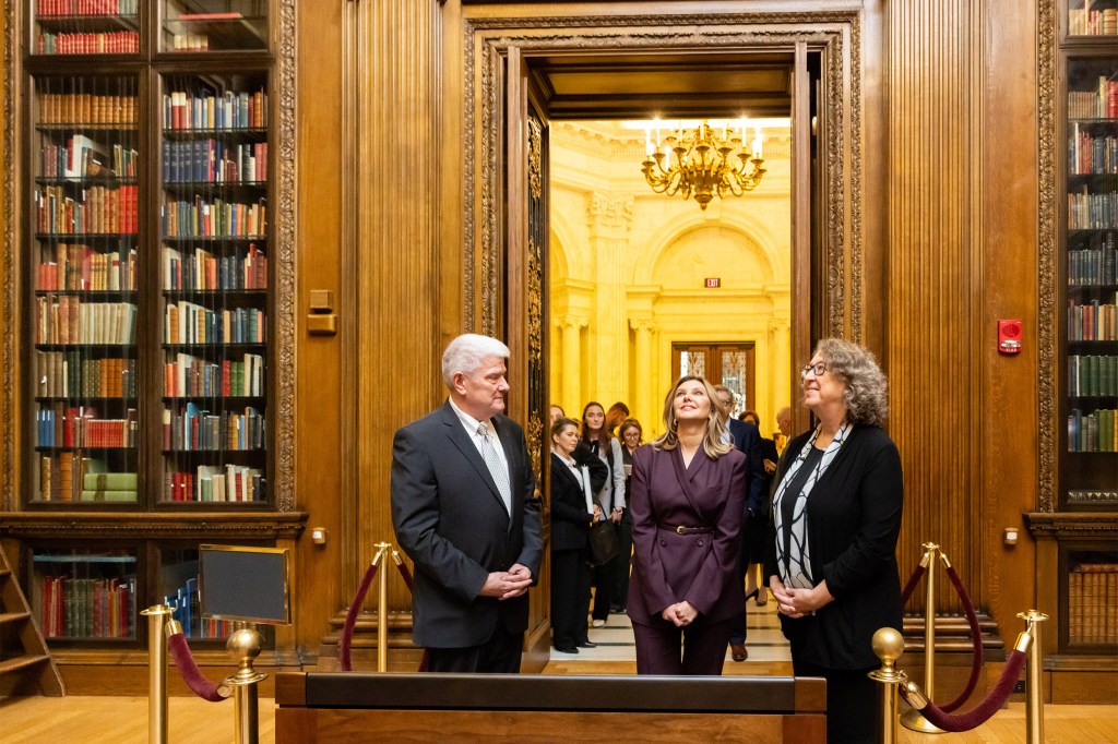 Olena Zelenska (center) takes in the Widener Memorial Room with curator Peter X. Accardo and University Librarian Martha Whitehead.