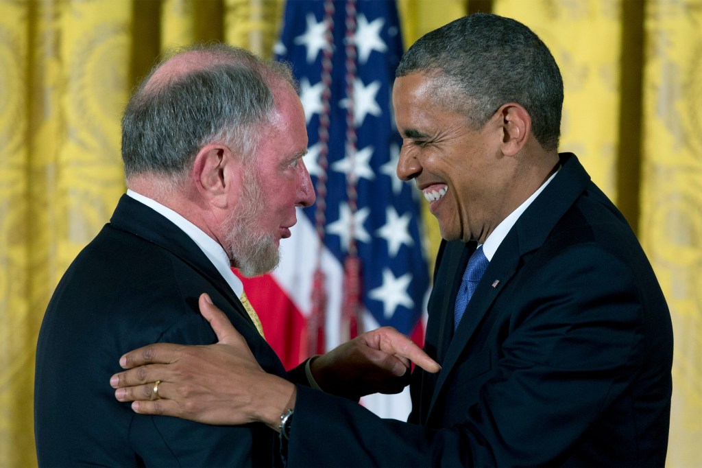 President Barack Obama laughs with Robert Putnam as he awards him the 2012 National Humanities Medal during a ceremony at the White House.