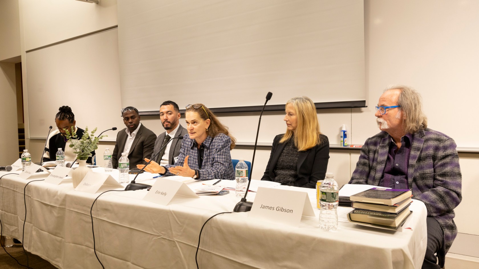 Marcus Hunter (from left), Daniel Fryer, Christopher Lewis, Debora Spar, Erin Kelly, and James Gibson speaking during the event. Photos of a panel from the CRISES “Are Reparations the Answer?” Conference held in William James Hall B1 at Harvard University. The panel is titled “Redefining Justice: Moral, Ethical, and Political Dilemmas in Addressing Reparations and Racial Justice,” and features Daniel Fryer, Assistant Professor of Law and Philosophy at the University of Michigan, Christopher Lewis, Assistant Professor at Harvard Law School, James Gibson, Sidney W. Souers Professor of Government at Washington University in St. Louis, Debora Spar, Jaime and Josefina Chua Tiampo Professor of Business Administration at Harvard Business School, and Erin Kelly, Fletcher Professor of Philosophy at Tufts University. Marcus Hunter, Scott Waugh Endowed Chair in the Social Sciences Division, Professor of Sociology & African American Studies at the University of California Los Angeles, is the panel’s discussant. 