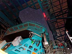 This photo shows Rubin's Simonyi Survey Telescope taking on-sky observations/