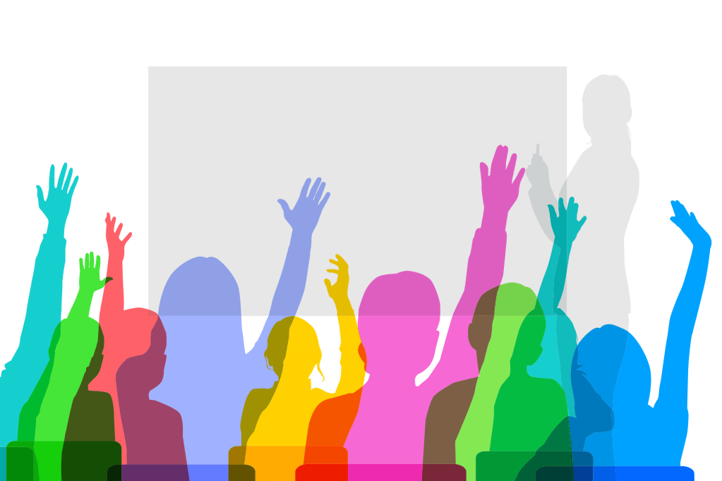 Illustration of students with hands raised and teacher at chalkboard.