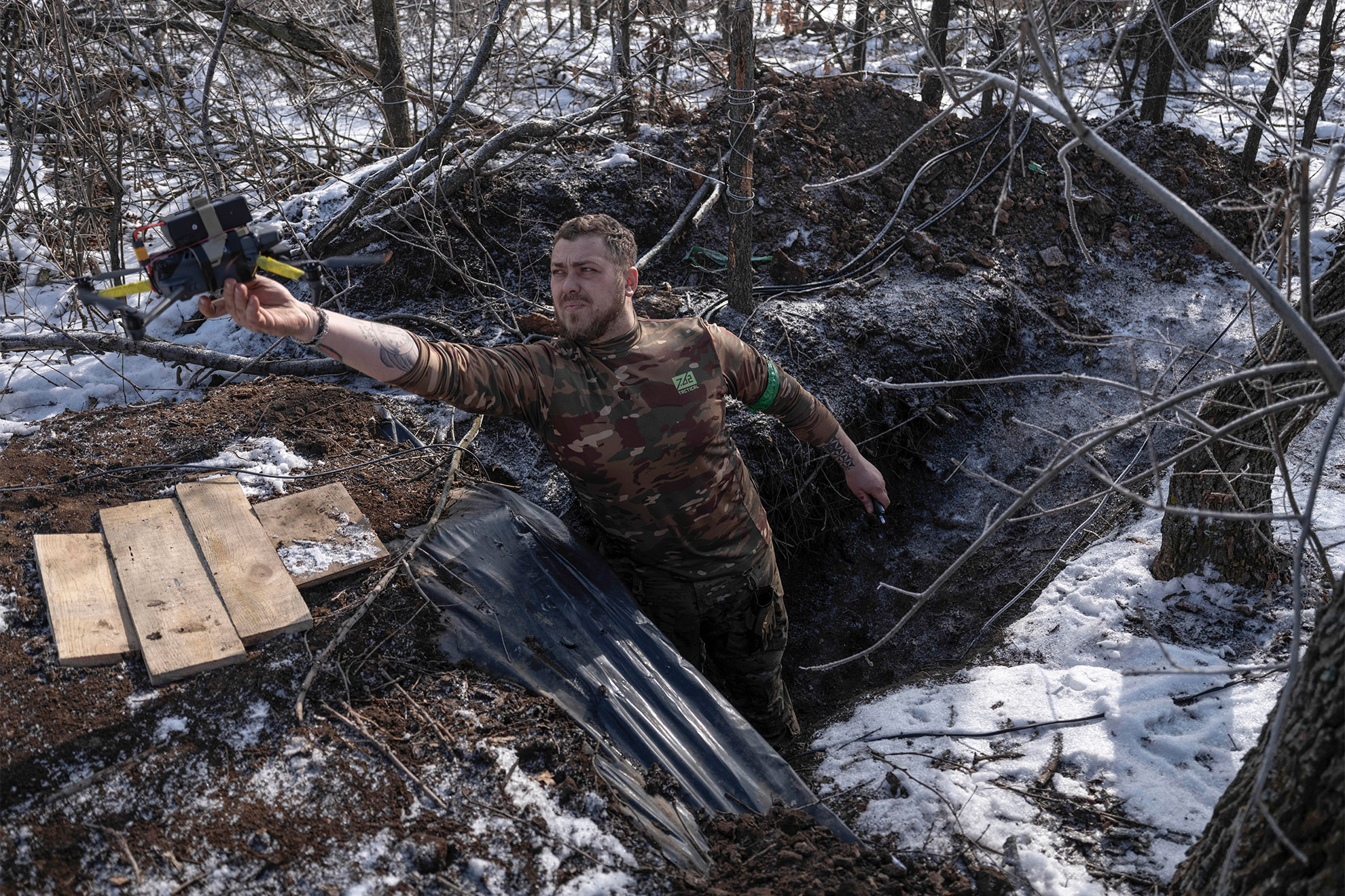 a Ukrainian soldier launches a drone from a shelter in partially occupied Toretsk, the site of heavy battles with the Russian troops in the Donetsk region, Ukraine,.