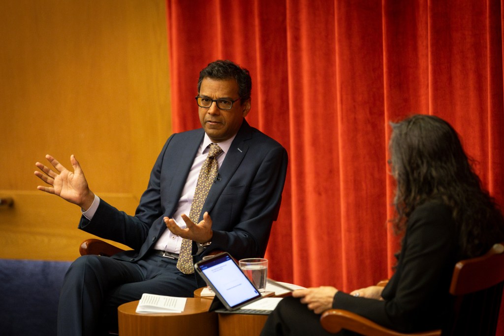 Atul Gawande speaking with Marcia Castro.