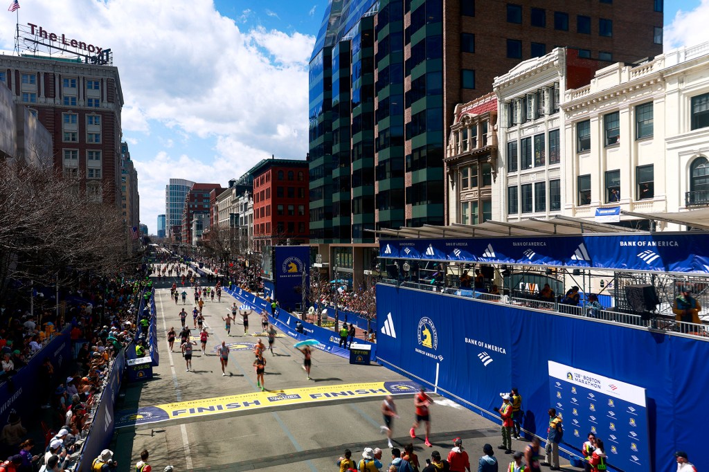 Runners cross the finish line of the 2024 Boston Marathon.