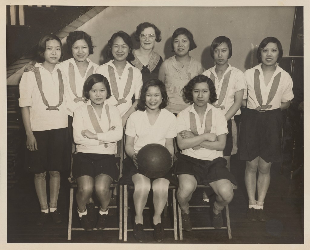 A black-and-white photograph of a girls basketball team