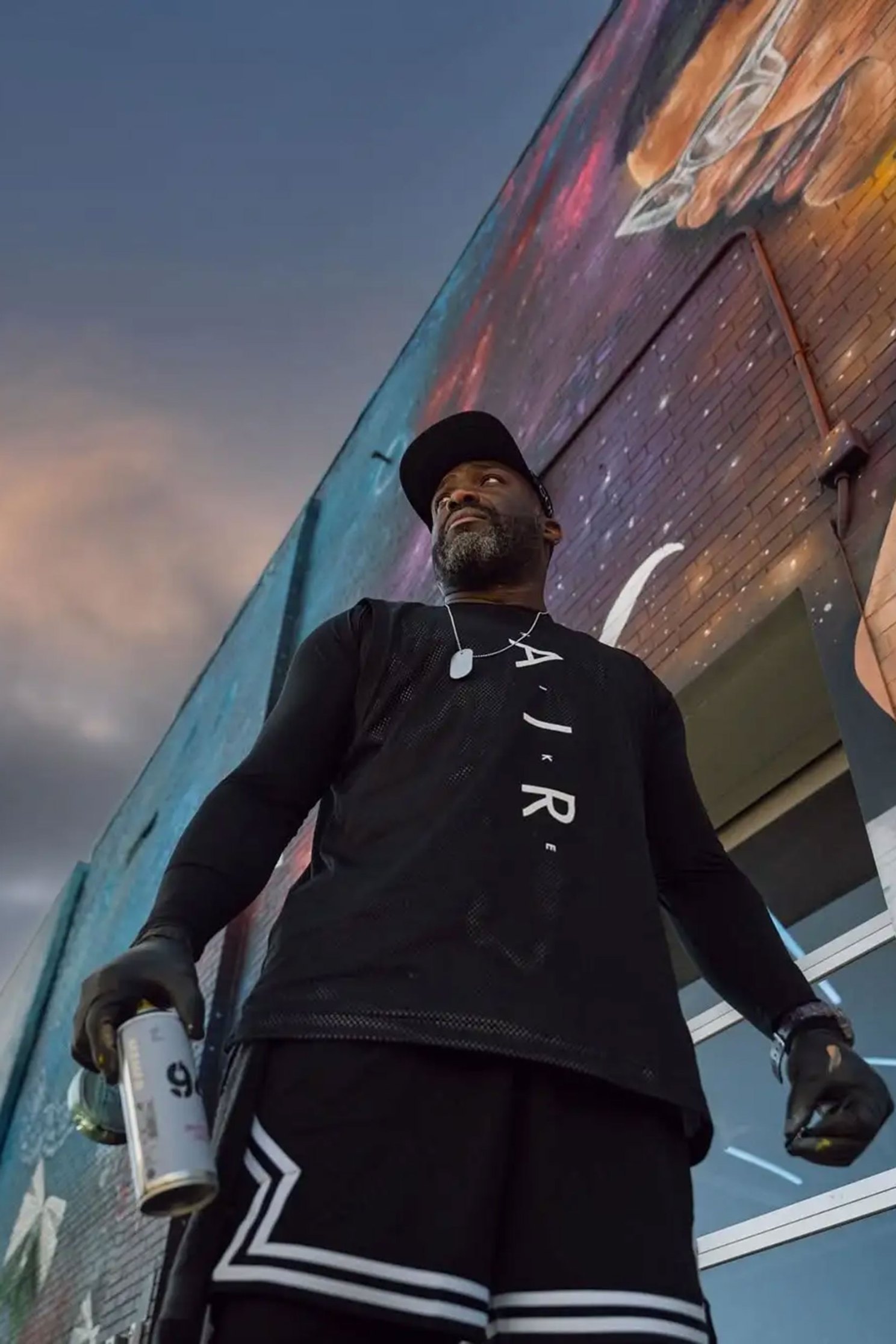 ProBlak with a mural.