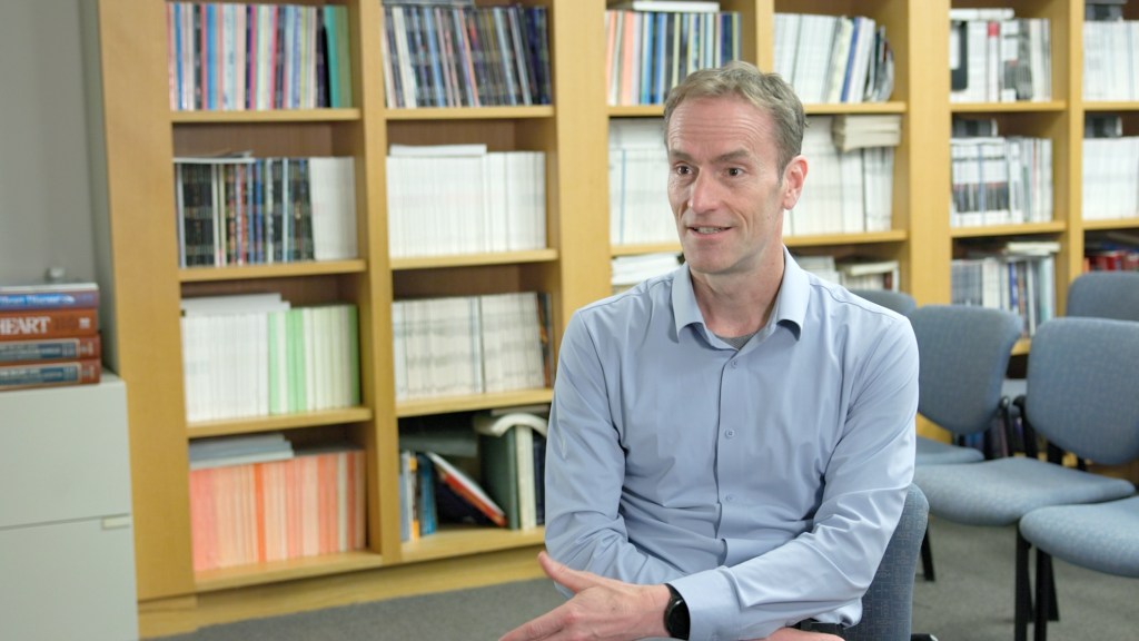 Professor Duane Wesemann being interviewed by the Gazette