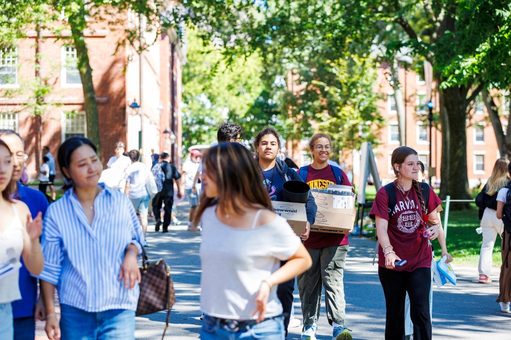 First-year students and their families in Harvard Yard during move-in day.