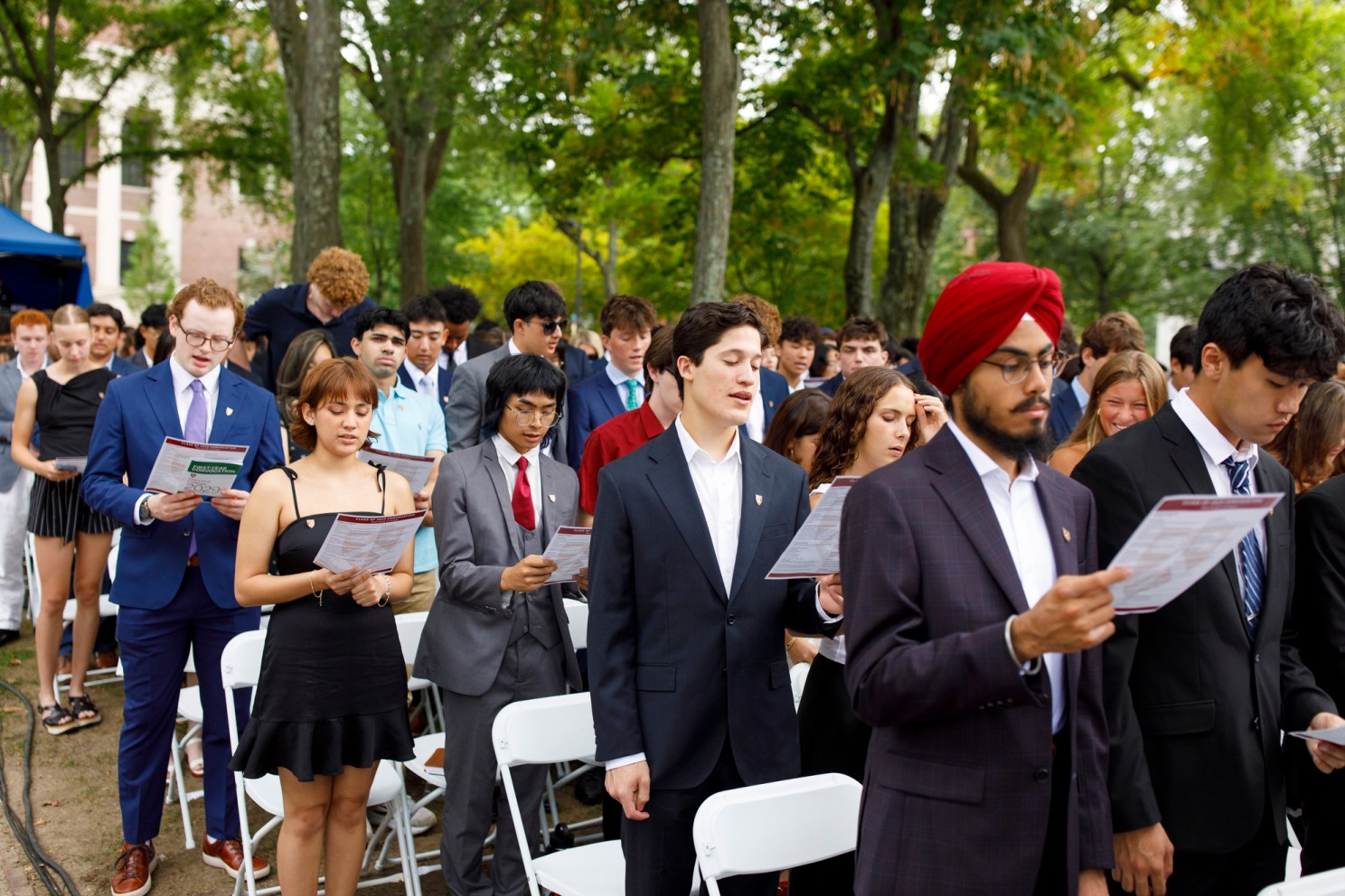 First-year students sing Harvard’s alma mater song, “Fair Harvard”