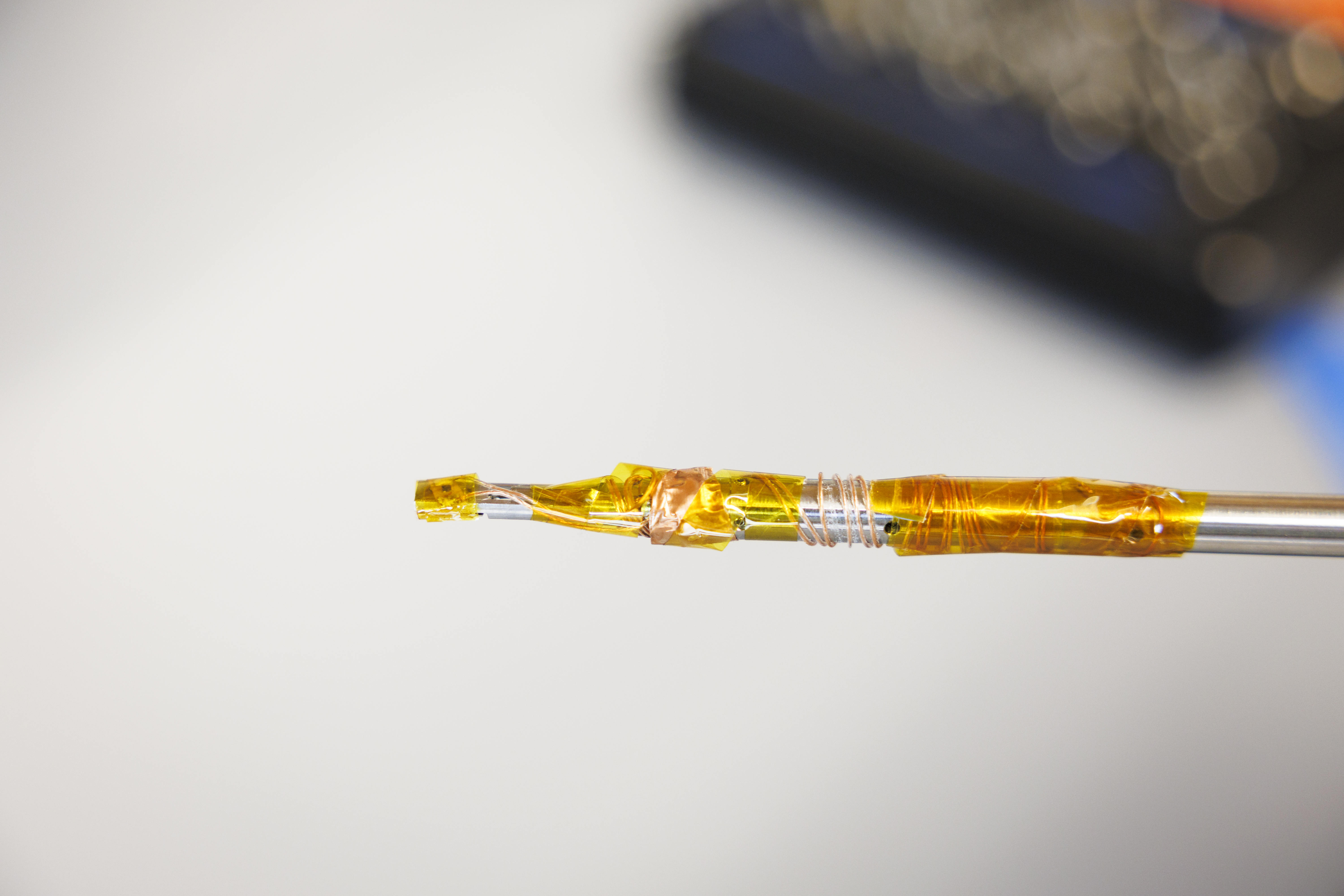 A close up of an electron microscope specimen holder.