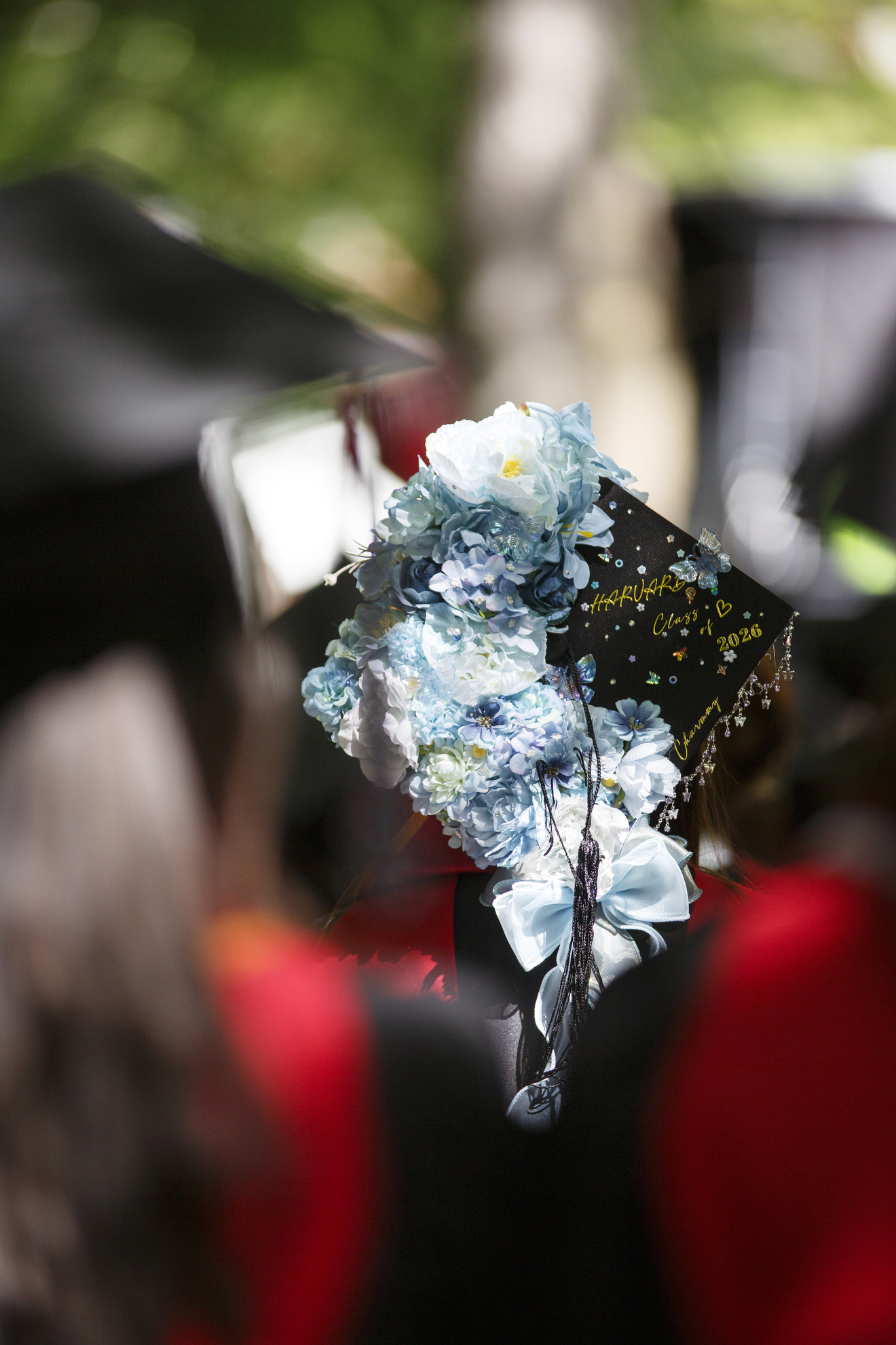 A graduate wears a customized mortarboard. 