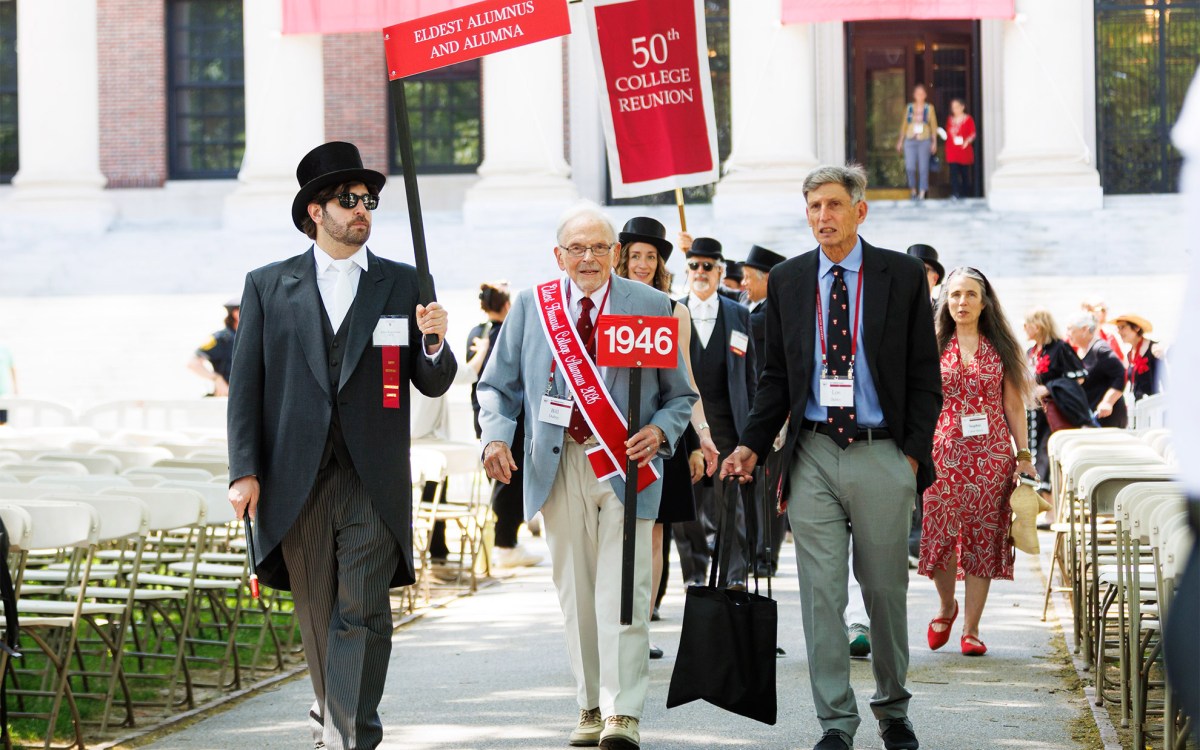 Bill Dubey ’46, the eldest male Harvard College alumnus present, processes into Tercentenary Theatre.