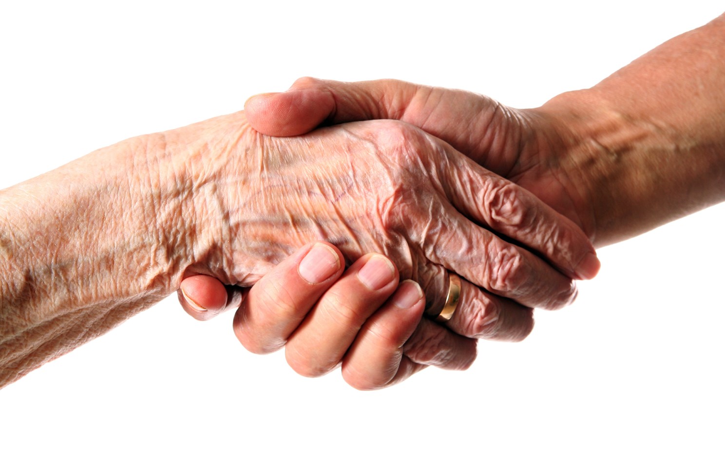 Wrinkled hand clutching a younger hand.